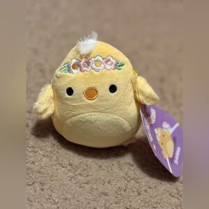 NWT yellow bird with a flower crown Squishmallows whose name is Triston